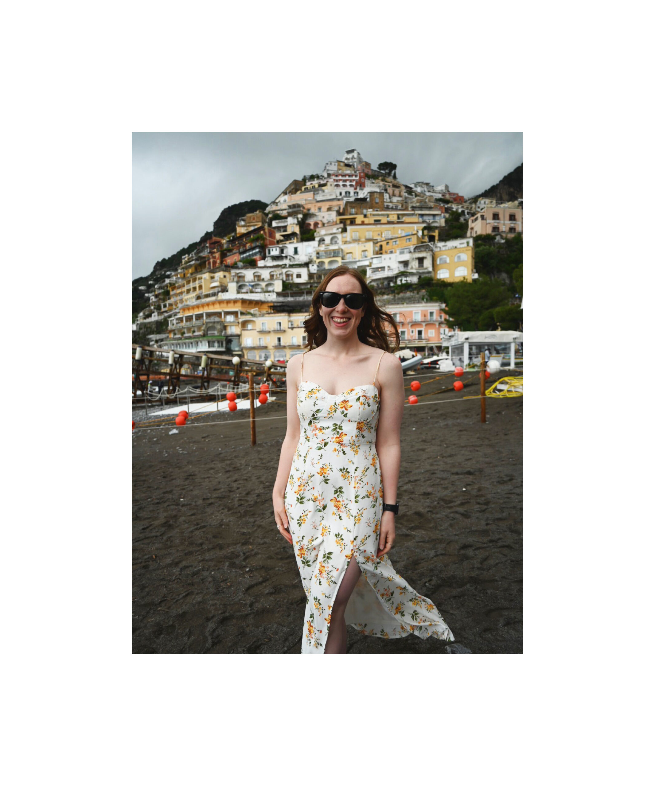 A women standing on Spiaggia Grande beach in Positano.